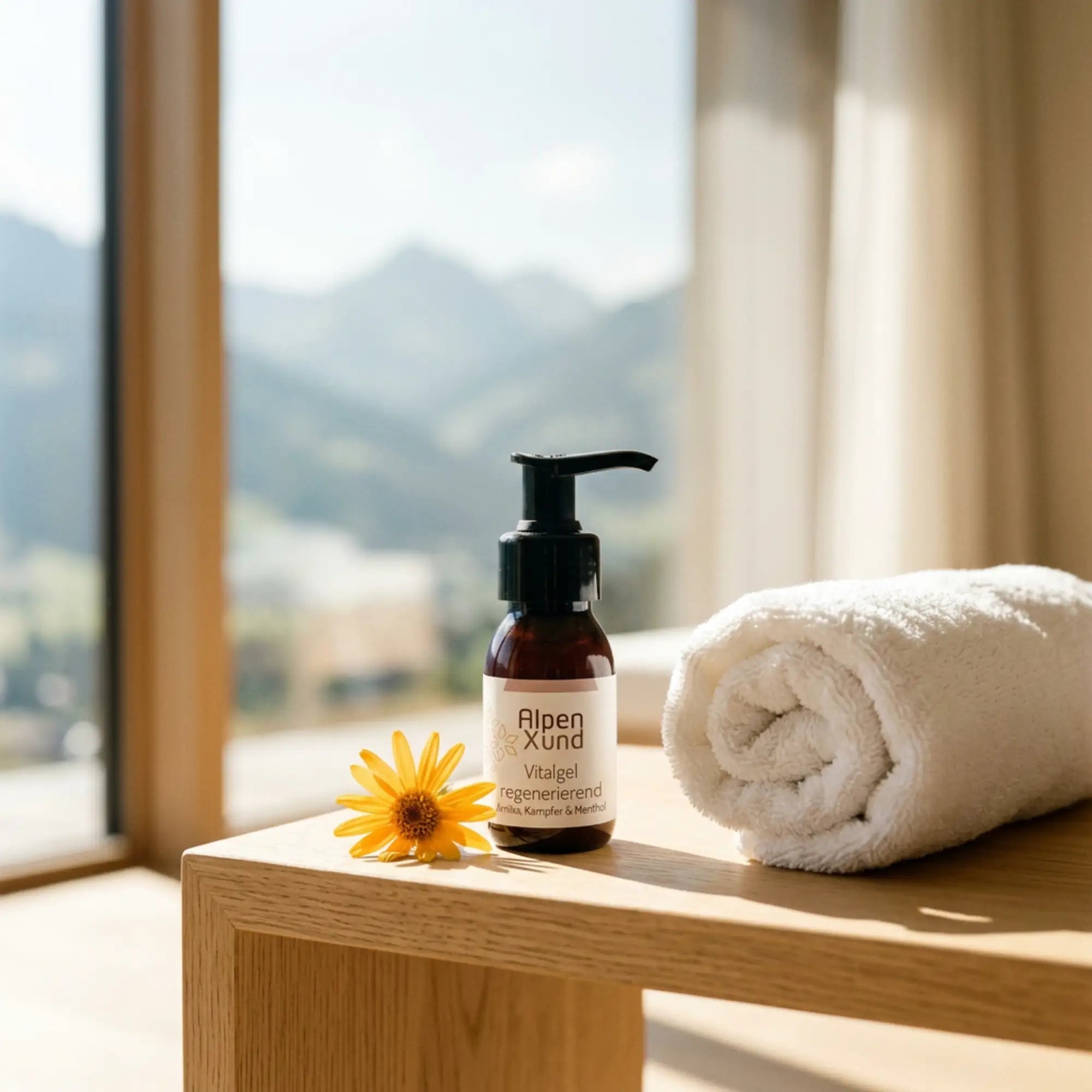 Vitalgel 60ml Braunglasflasche auf einem Eichentisch neben einem weissen Handtuch in einem hellen alpinen Spa.